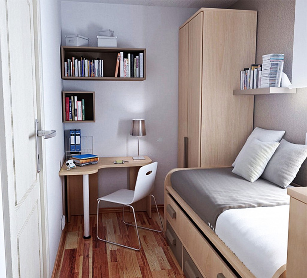 small Studio Apartment Decorating bedroom with corner l spaped desk and floating booshelve and laminate wood floor