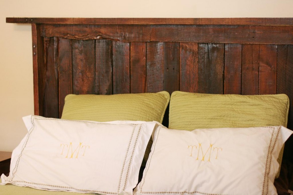 DIY Wood Headboard in small bedroom with white and soft yellow pillow in soft brown wall