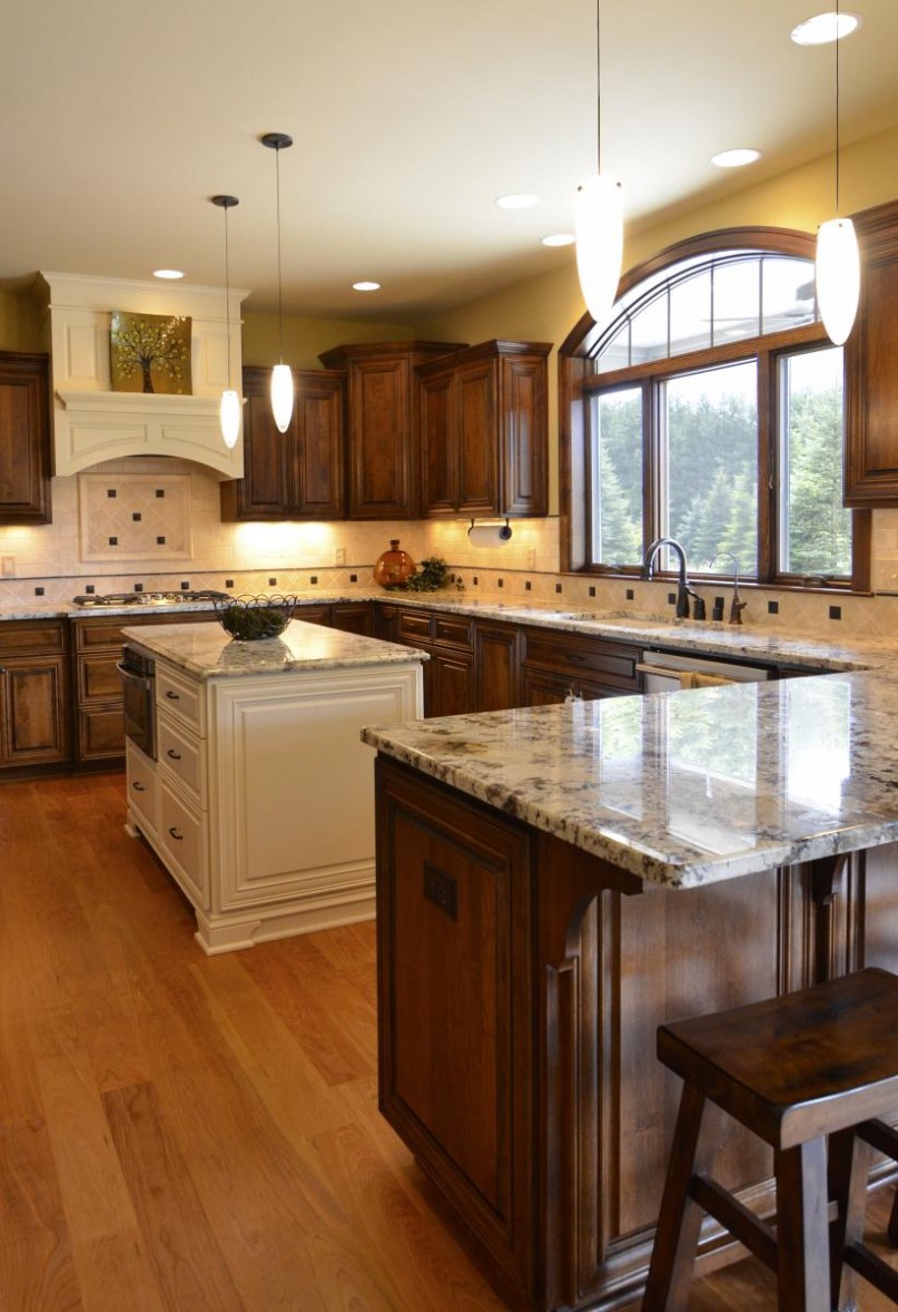 elegant u shaped kitchen design ideas with natural wood apliance and white island and almiante wood floor