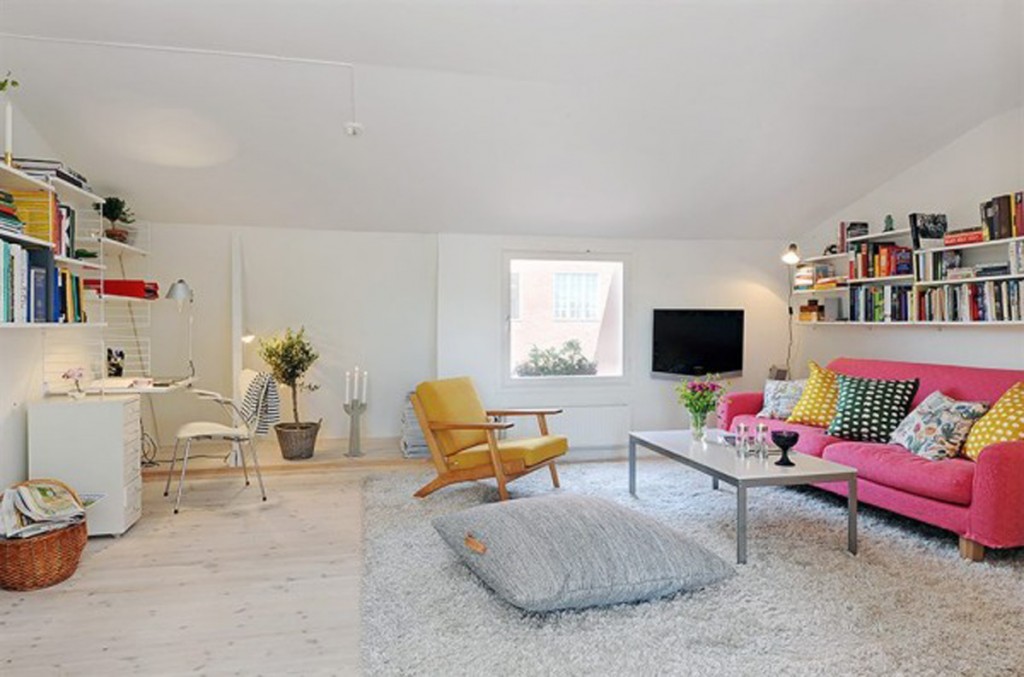 Apartment Living Room Decorating Ideas with home office with white desk pink sofa and floating bookshelve
