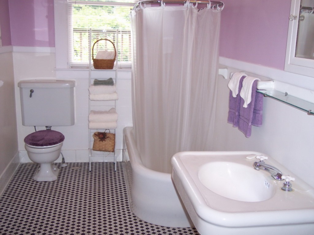Small Bathroom Remodel With Clawfoot Tub with curtain and white and purple wall and black and white floor