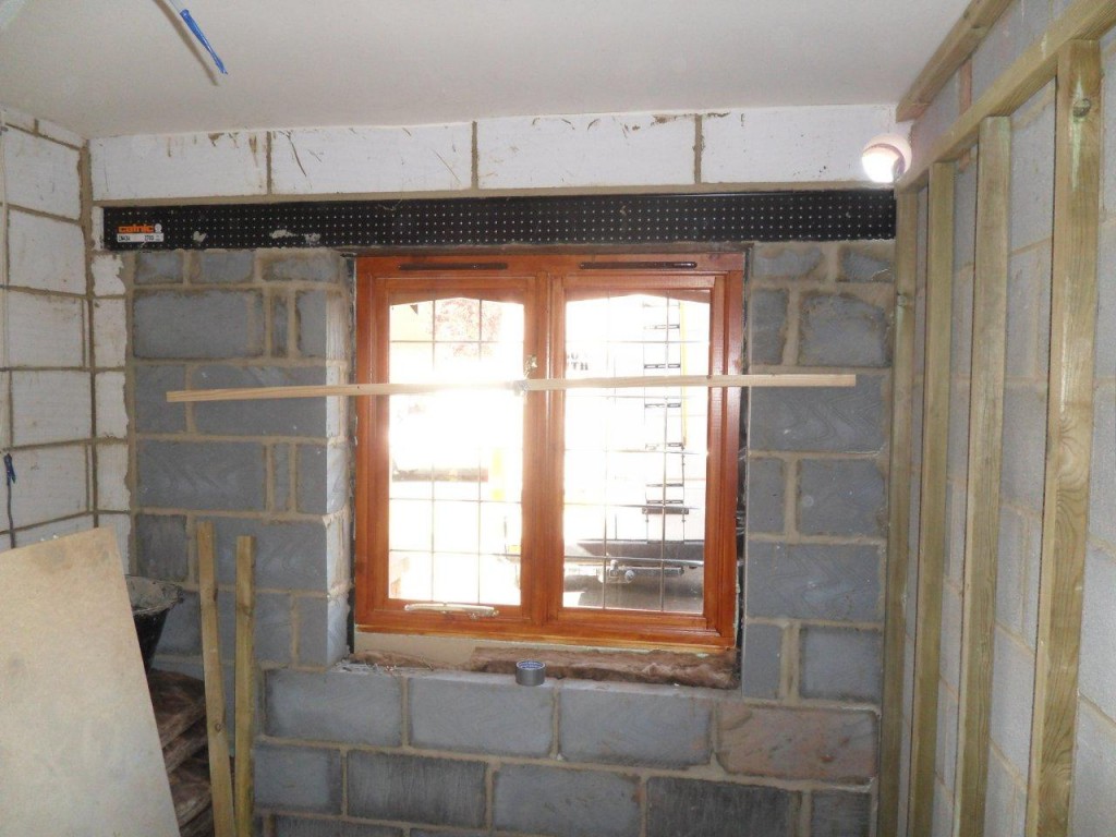 garage conversion in chippenham wiltshire builders bucks dracom with brown window treatment and brick wall