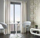 modern window treatment idea with cream curtain white lovely seating grey wall black wooden floor
