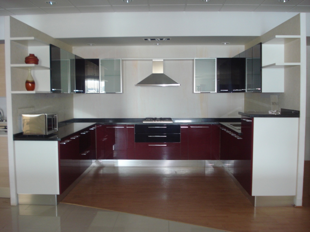 Modular u shaped Kitchens ideas with dark purple apliances wit black floating shelve and porcelain floor